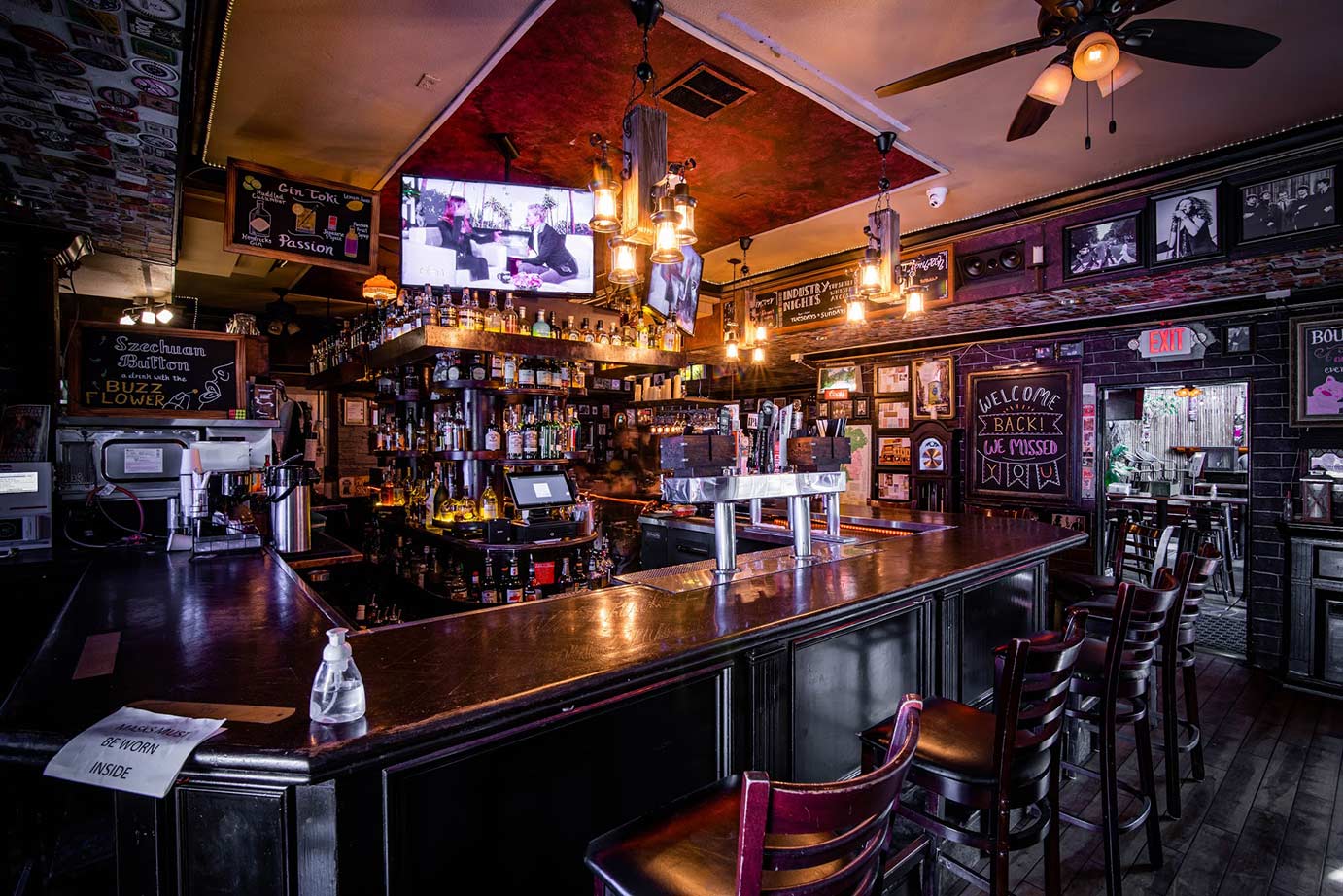 Bar in a restaurant with drinks and chairs